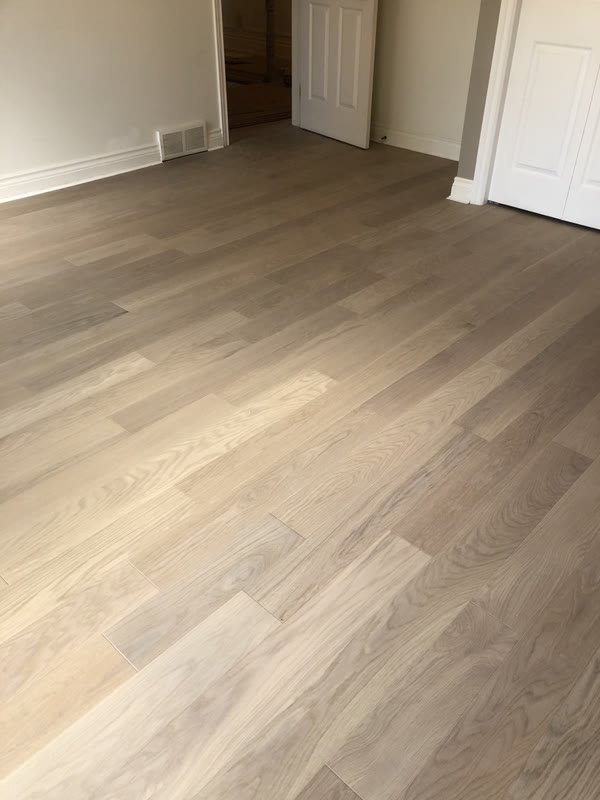 Living room with a fresh medium-oak plank floor